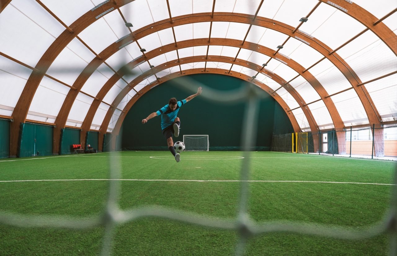 cinematic image of a soccer freestyle player making tricks with the ball